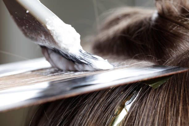 Close up of highlight application with bleach